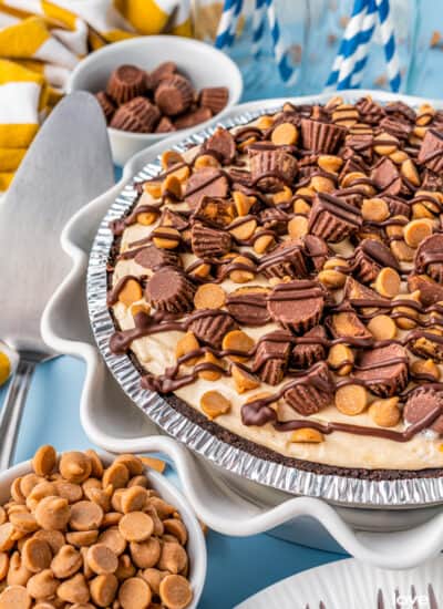 A photo of a peanut butter pie on a blue background