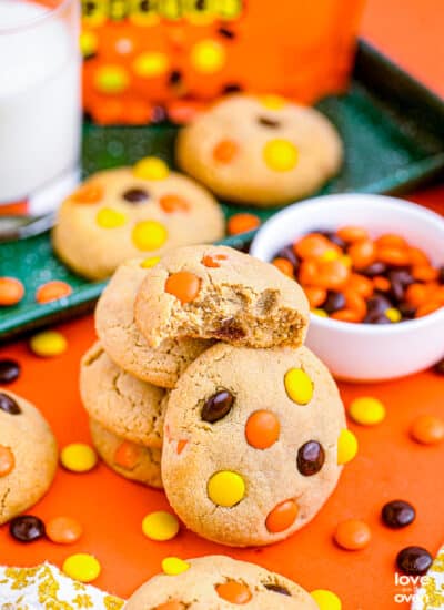 Reese's Pieces cookies on an orange background.