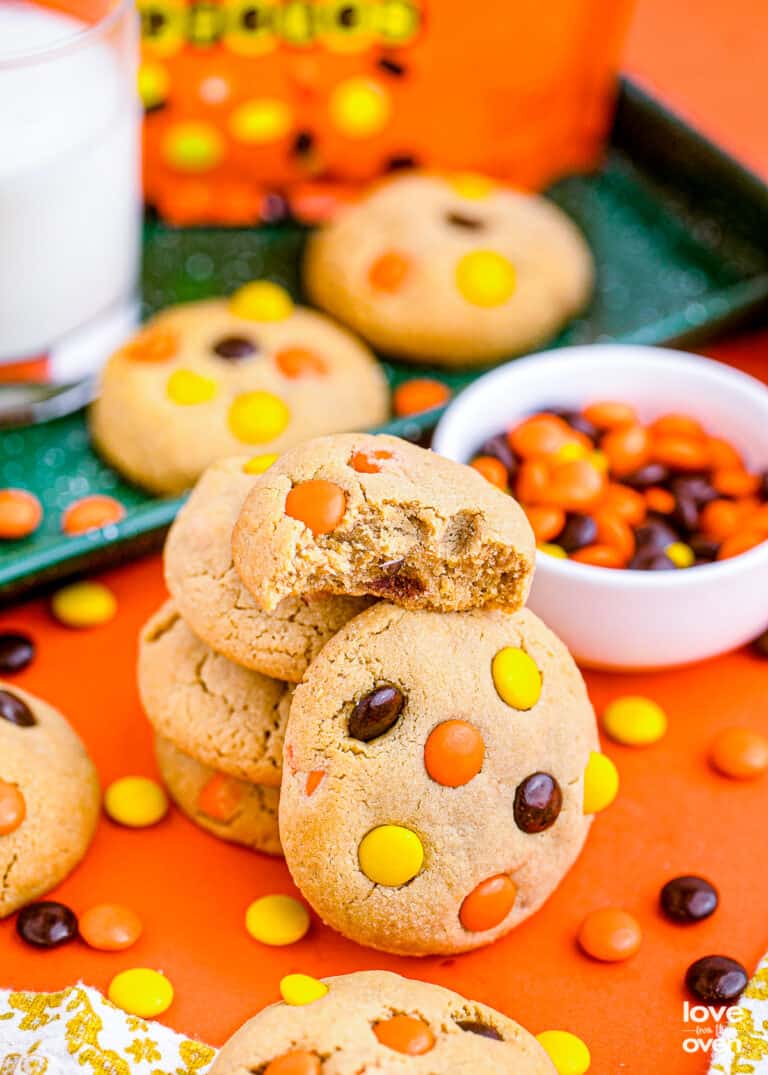 Reese's Pieces cookies on an orange background.