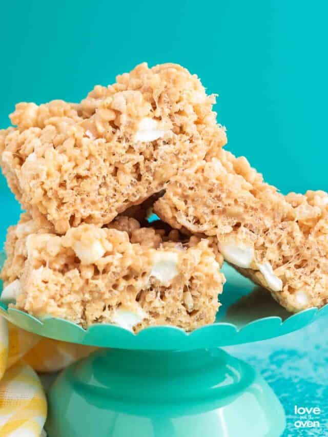 three rice krispie treats stacked on a blue stand