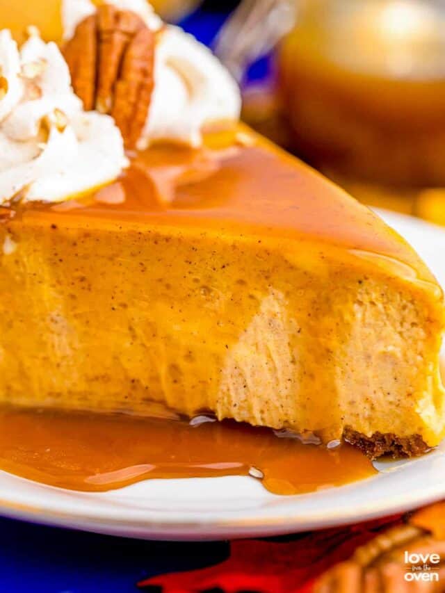 a slice of pumpkin cheesecake with caramel sauce on top