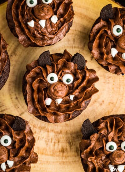 Halloween cupcakes decorated to look like werewolfs.