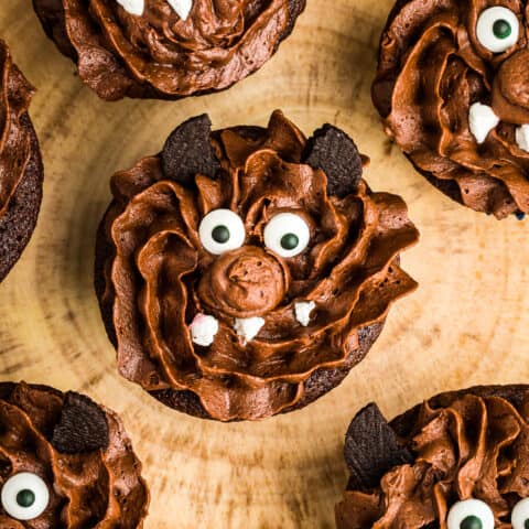 Halloween cupcakes decorated to look like werewolfs.