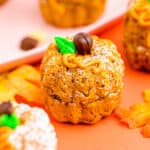 mini pumpkin bundt cakes on an orange background.