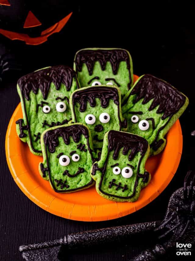 A plate of halloween cookies that look like Frankenstein.