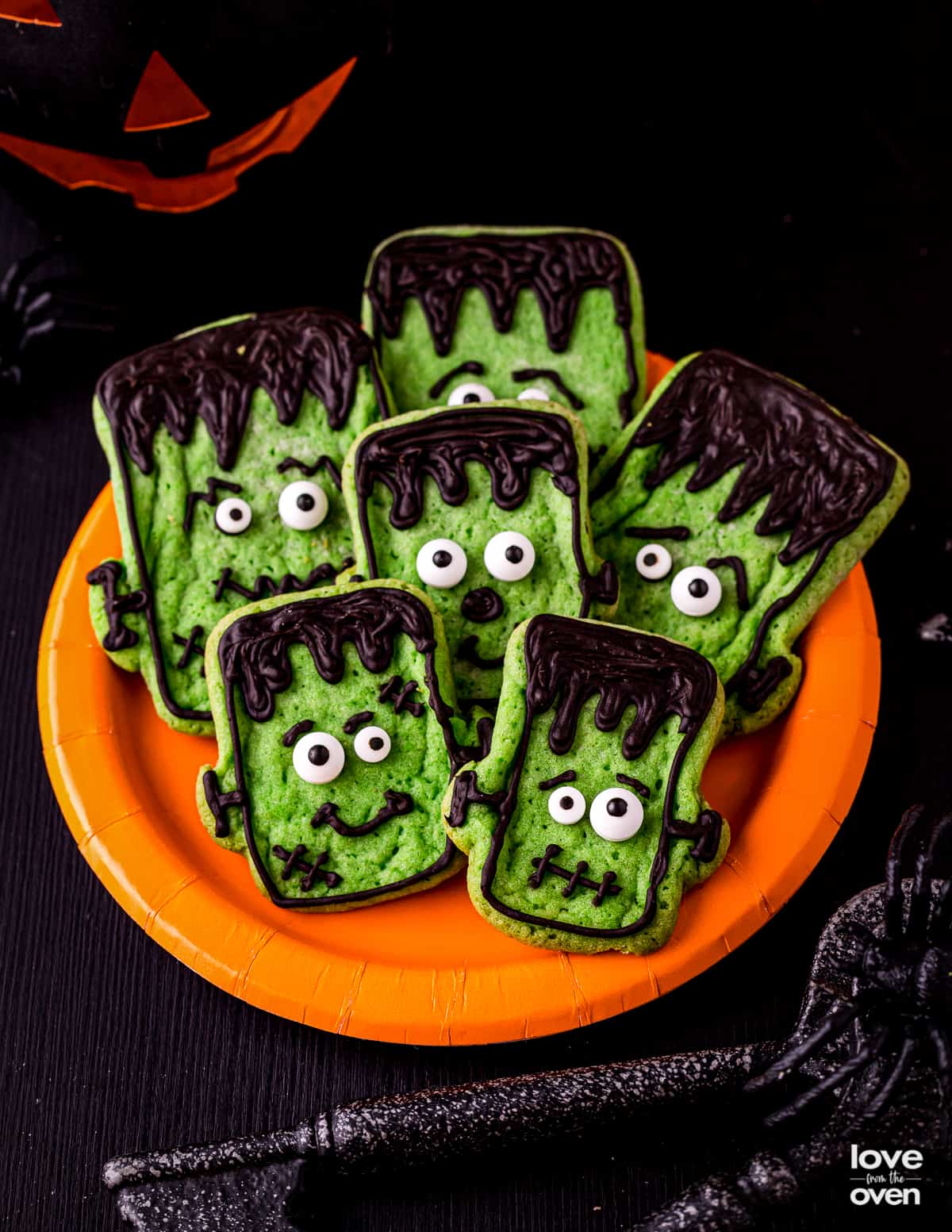 A plate of halloween cookies that look like Frankenstein.