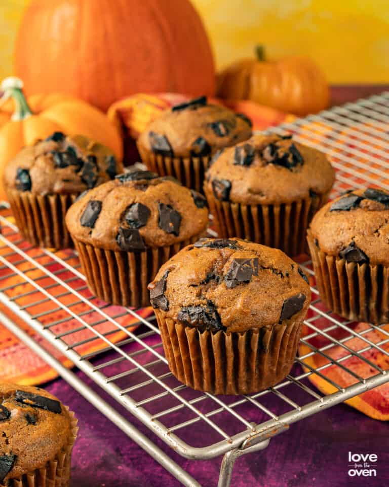 Pumpkin Chocolate Chip Muffins on a wire cooling rack.