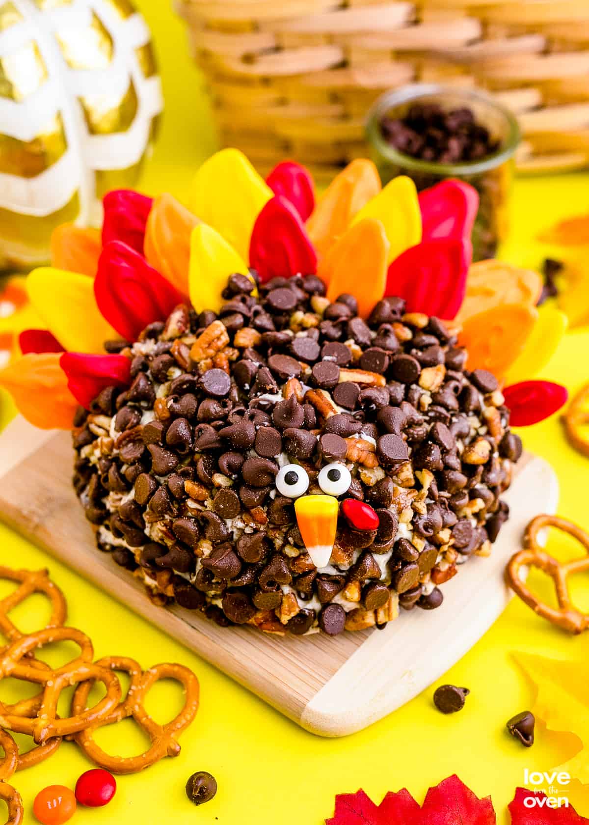 a turkey cheeseball on a wooden cutting board