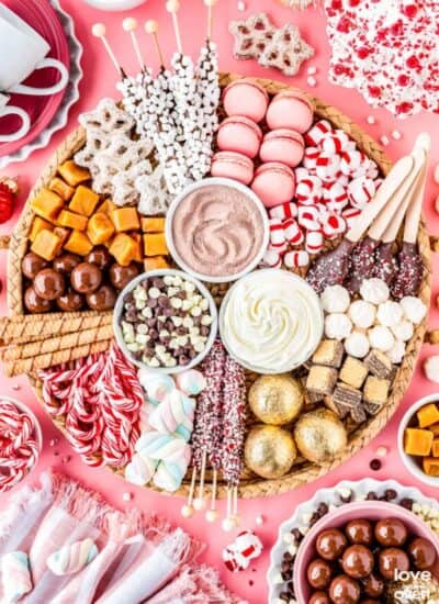 A hot chocolate charcuterie board filled with toppings and candies.