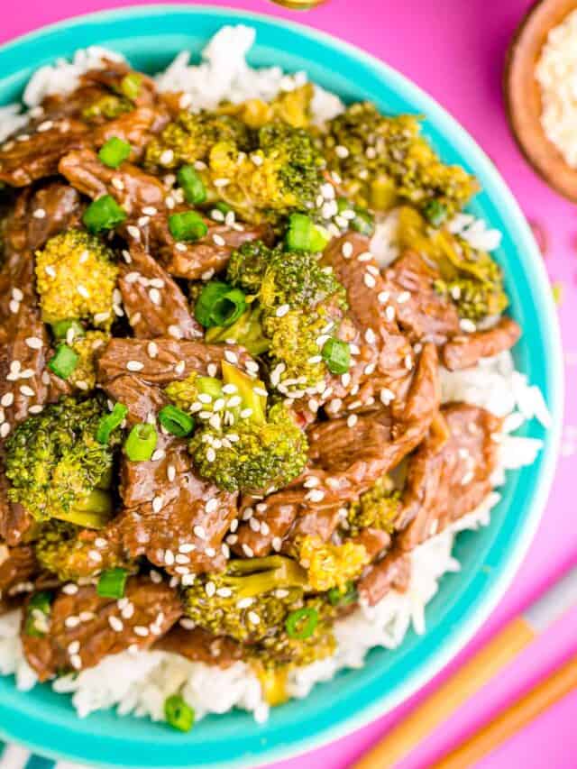 beef and broccoli on white rice in a turquoise bowl