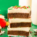 a stack of homemade gingerbread bars with cream cheese frosting