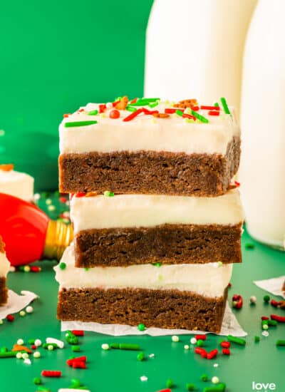 a stack of homemade gingerbread bars with cream cheese frosting