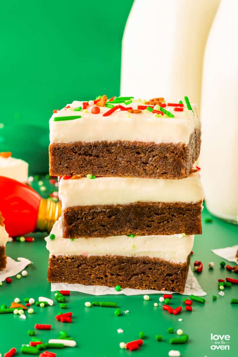 a stack of homemade gingerbread bars with cream cheese frosting