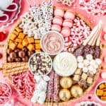 A hot chocolate charcuterie board filled with toppings and candies.