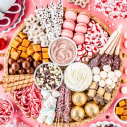 A hot chocolate charcuterie board filled with toppings and candies.