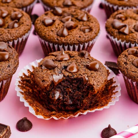 Chocolate Chocolate Chip muffins on a pink background