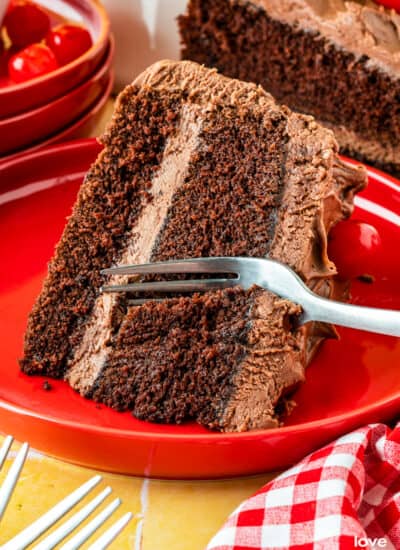 A fork taking a slice out of a mayonnaise cake