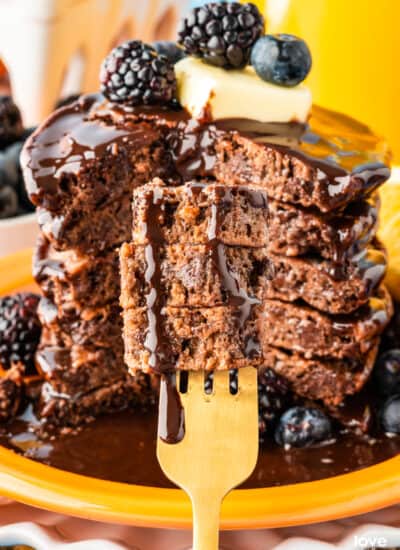 Chocolate pancakes on a gold fork.