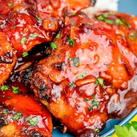 A close up of cranberry chicken on a plate.