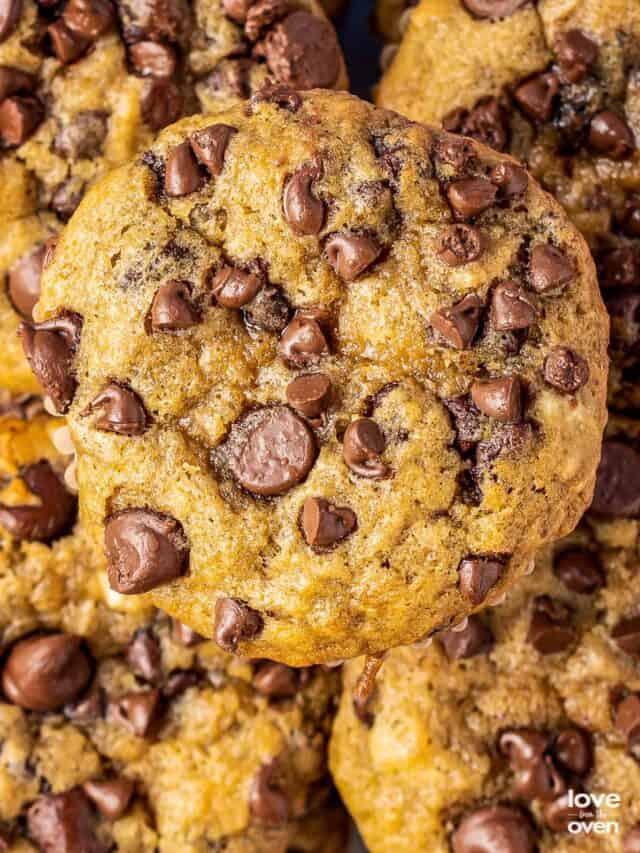 a close up of a banana chocolate chip muffin