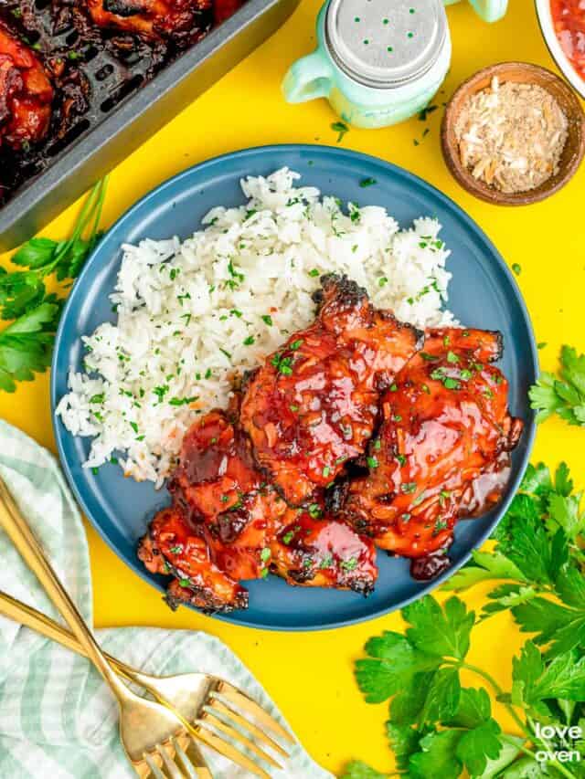 cranberry chicken served with white rice on a blue plate