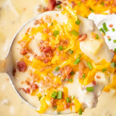 A ladle full of sausage potato soup