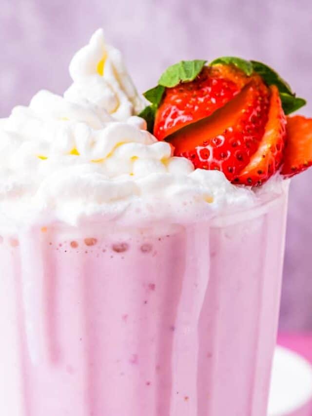 a close up of a strawberry milkshake