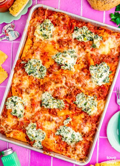 a sheet pan lasagna on a purple background