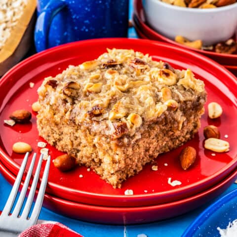 a slice of oatmeal cake on a red plate