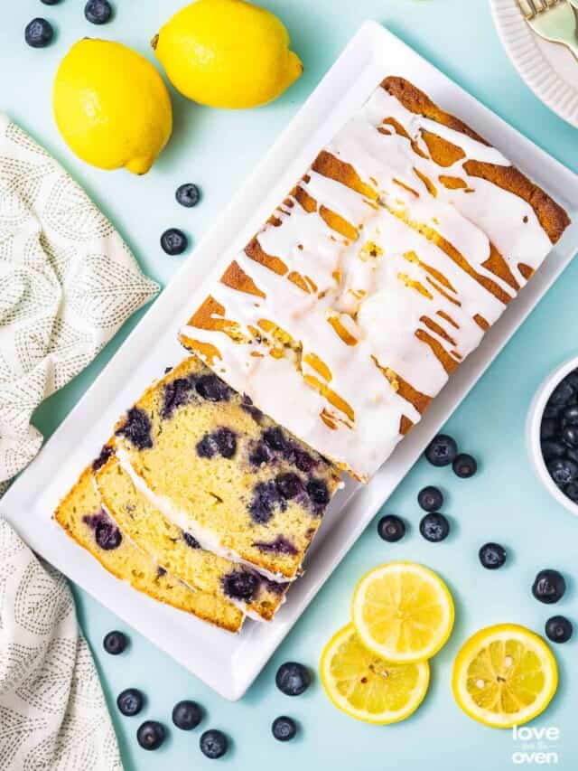 overhead shot of a loaf of lemon blueberry bread that has been sliced up