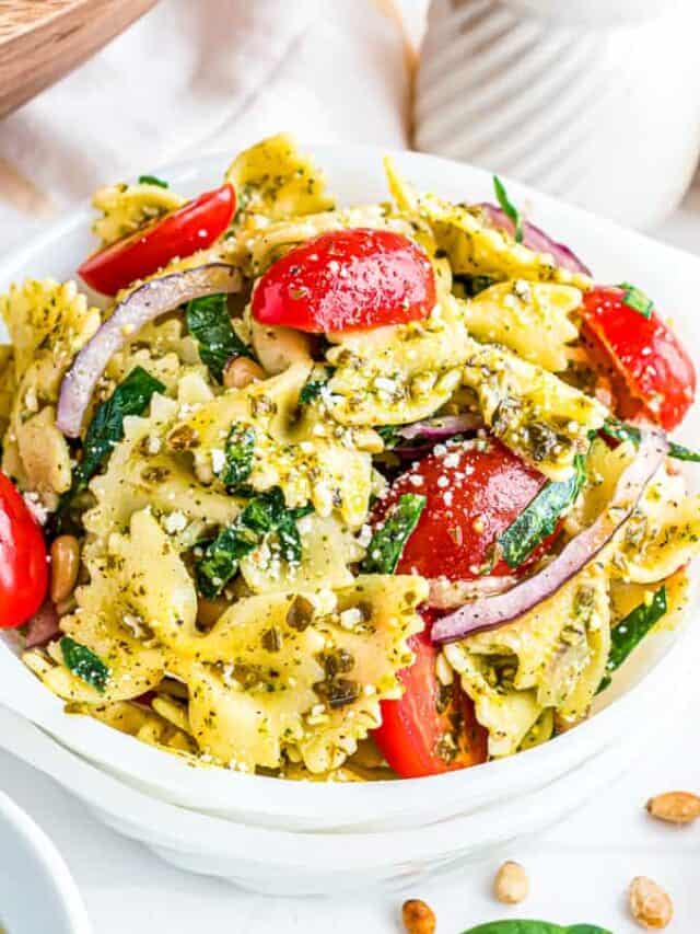 pesto pasta salad in a white dish