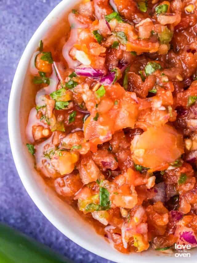 a close up of homemade salsa in a bowl