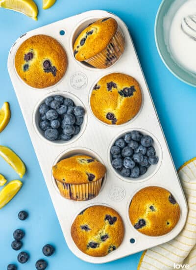 lemon blueberry muffins in a muffin pan