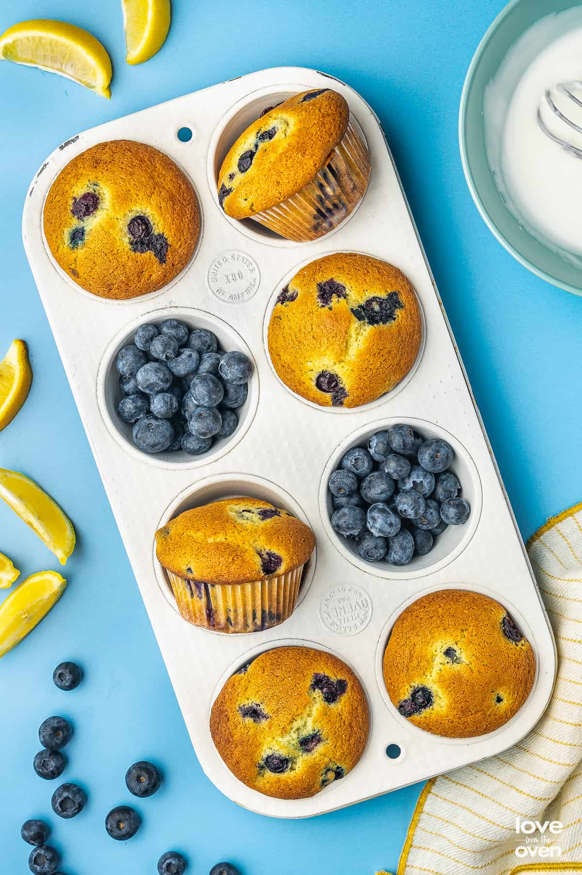 lemon blueberry muffins in a muffin pan