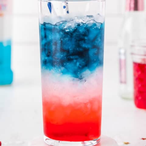 red white and blue cocktail on a coaster