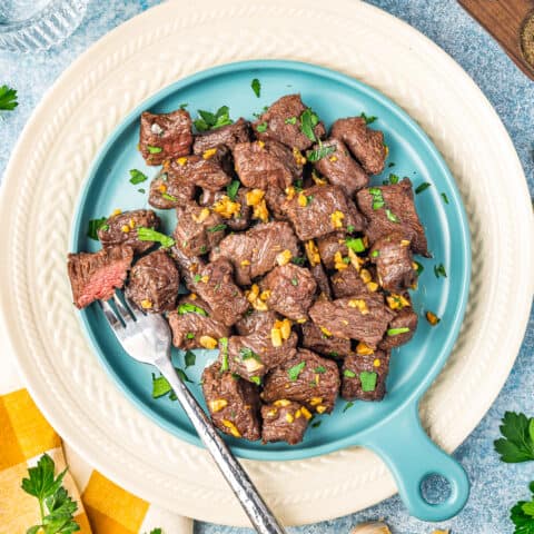 a plate of air fryer steak bites with a fork