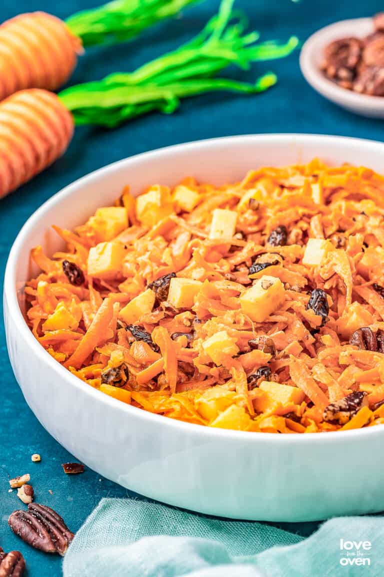 a bowl of carrot raisin salad