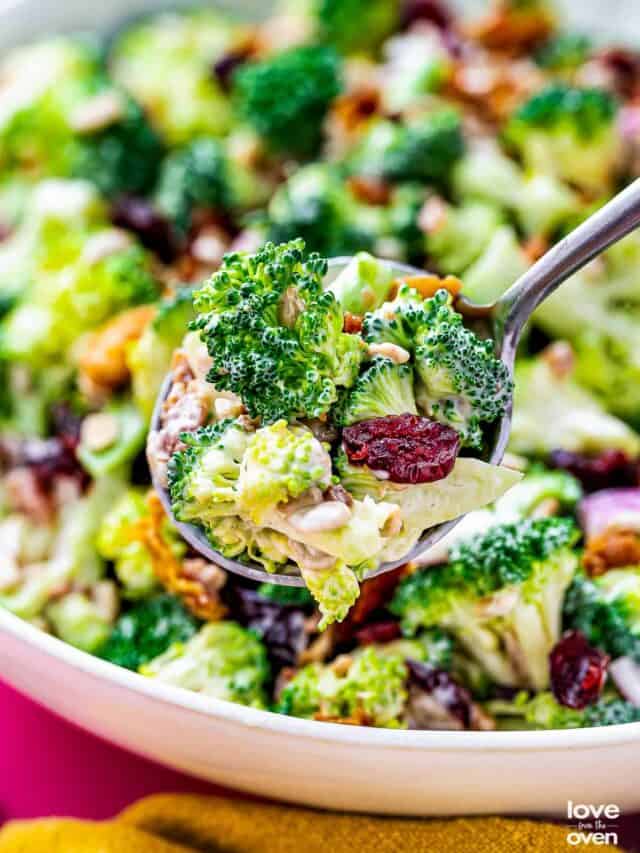 a spoon holding some broccoli salad