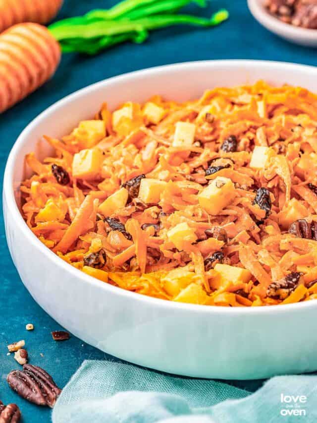 a bowl of carrot raisin salad