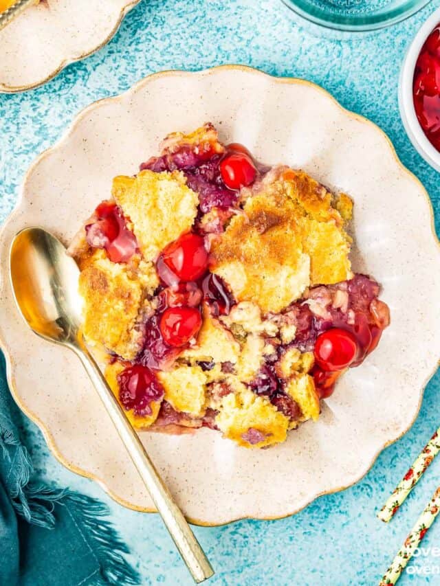 a plate of pineapple cherry dump cake