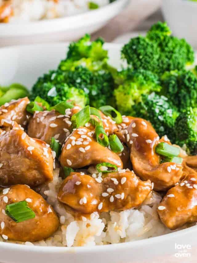 teriyaki chicken and vegetables over a bed of white rice