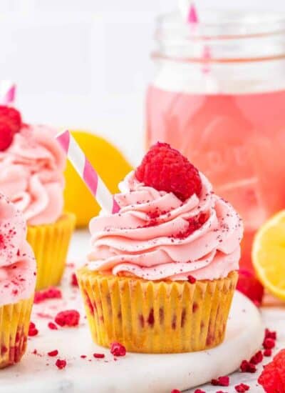 a lemon raspberry cupcake on a white background