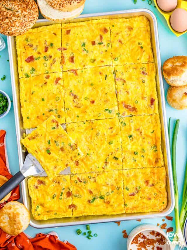 a spatula picking up some sheet pan eggs