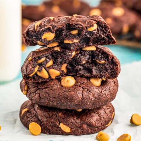 a stack of chocolate cookies with peanut butter chips