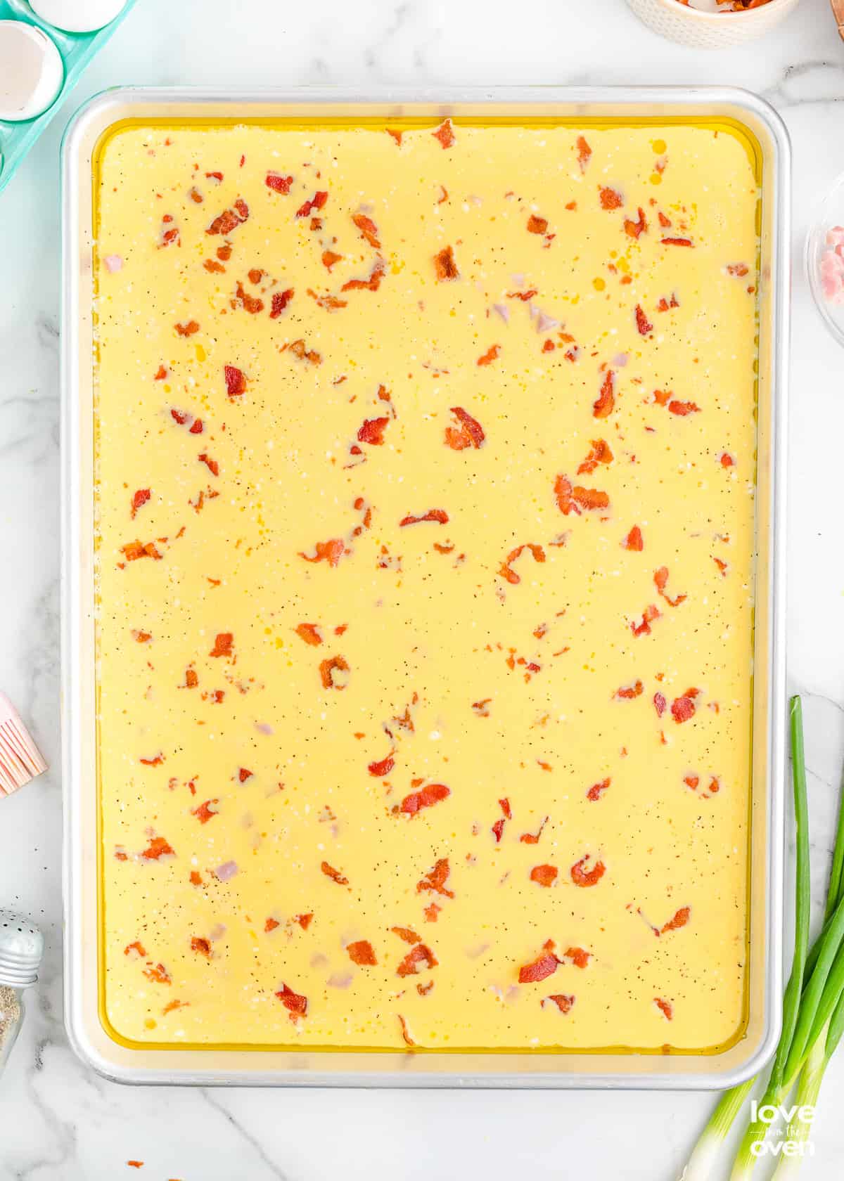 unbaked eggs in a sheet pan