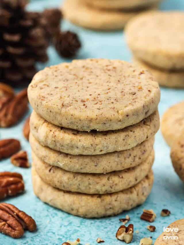 a stack of pecan sandies cookies