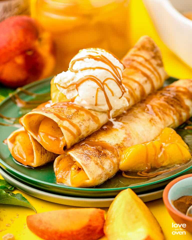 A plate of peach enchiladas