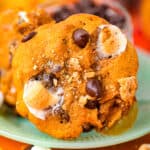 a pumpkin s'mores cookie on a green plate