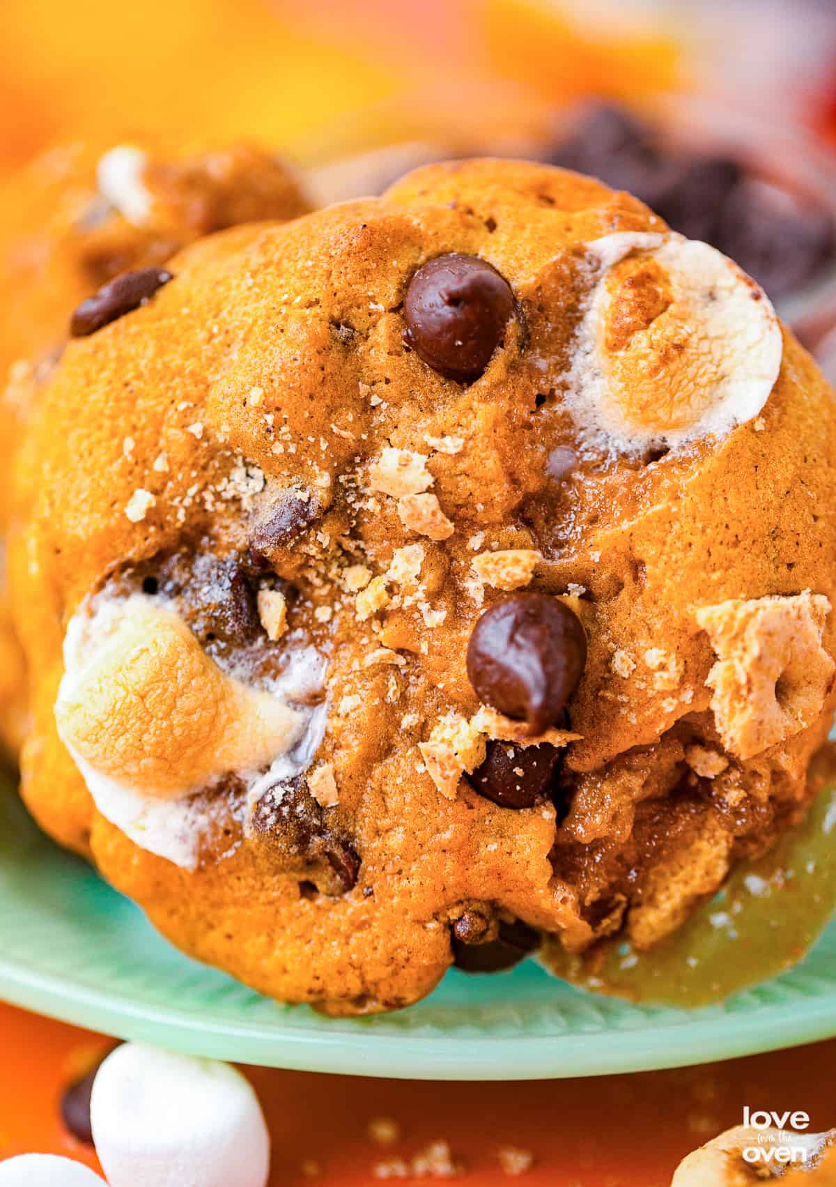 a close up photo of a pumpkin smores cookie