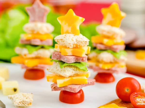 Christmas tree appetizers made from meat and cheese that are shaped like christmas trees